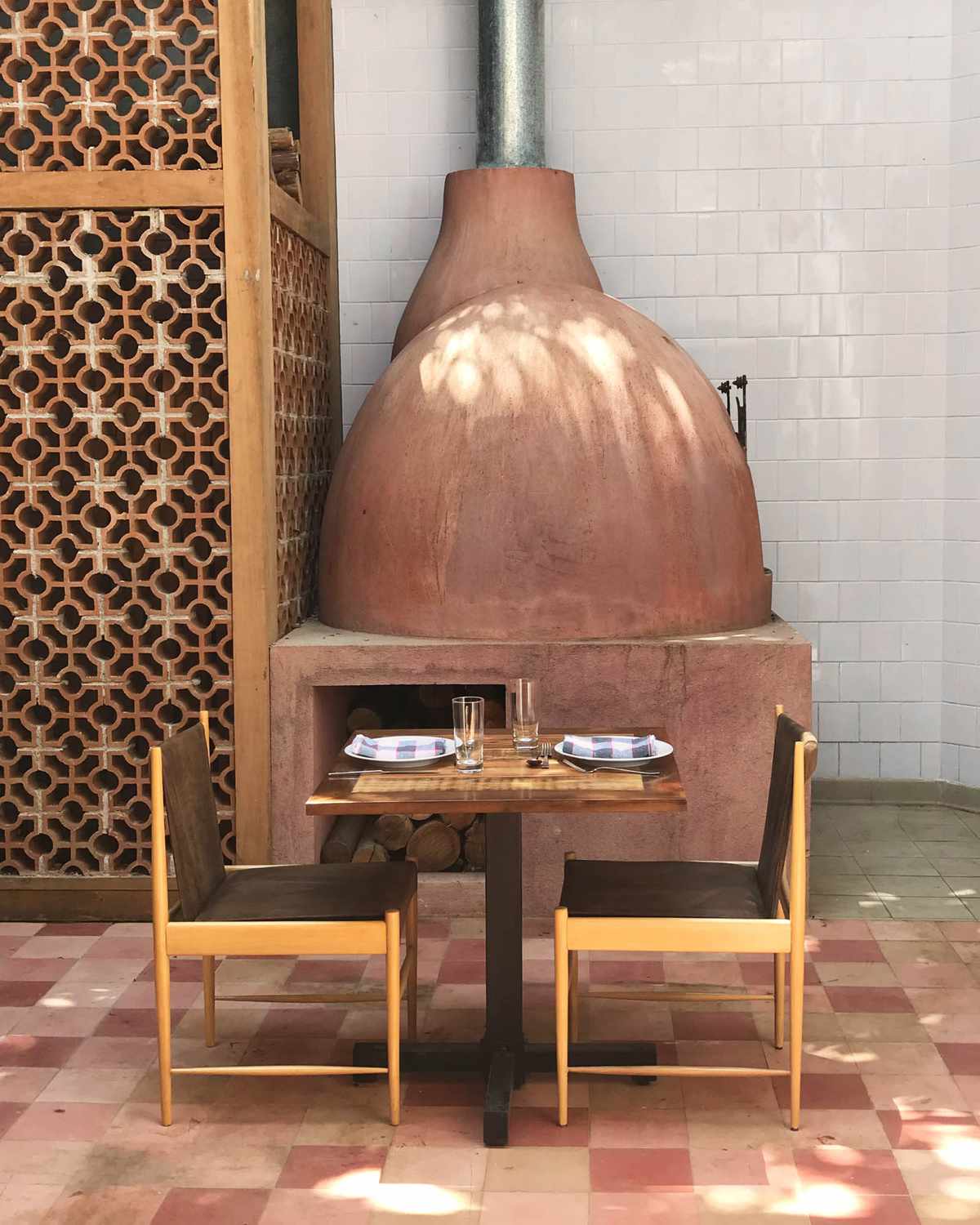 At Sud in Rio de Janeiro, a wood-fired oven informs a rustic menu in a small, cozy dining room.