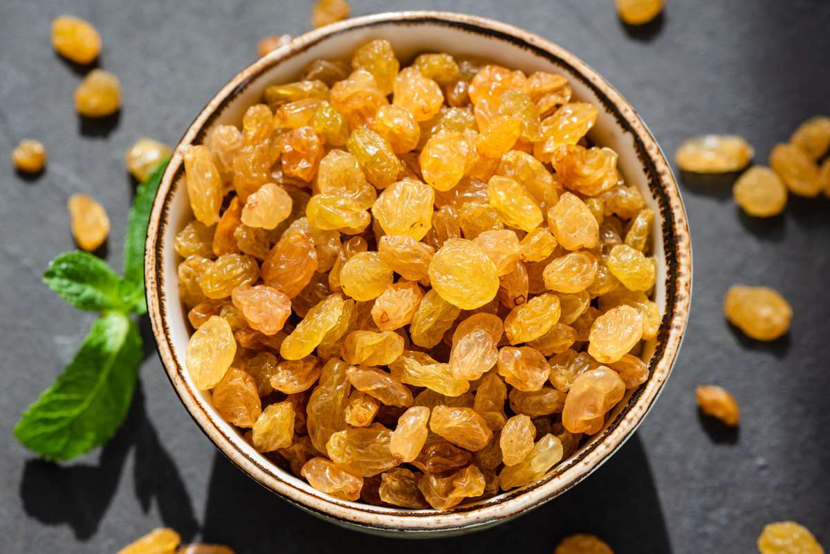 Golden Raisins In Bowl Closeup
