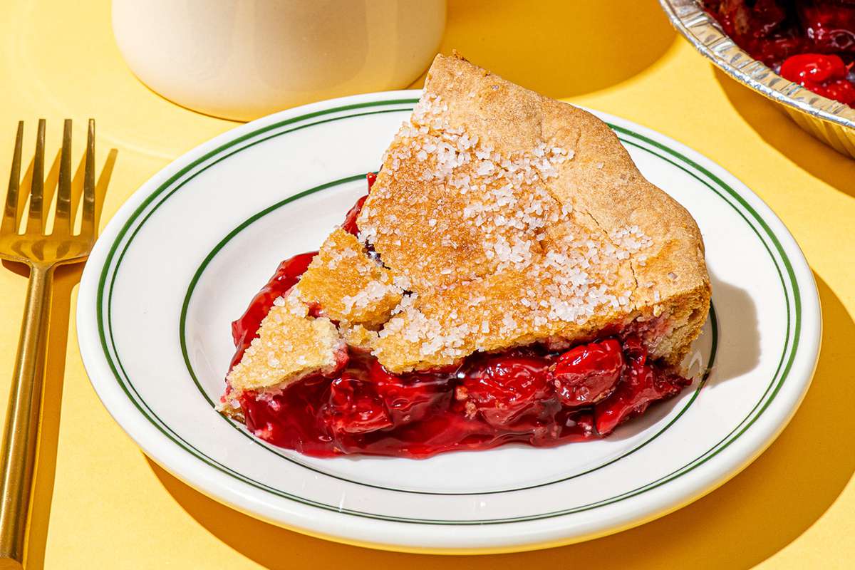 a plated slice of cherry pie