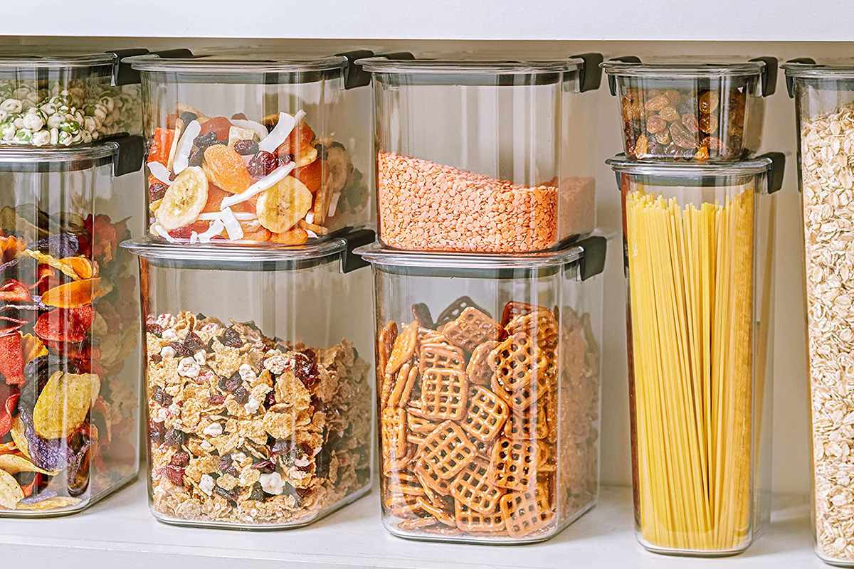 Rubbermaid containers filled with food on a pantry shelf