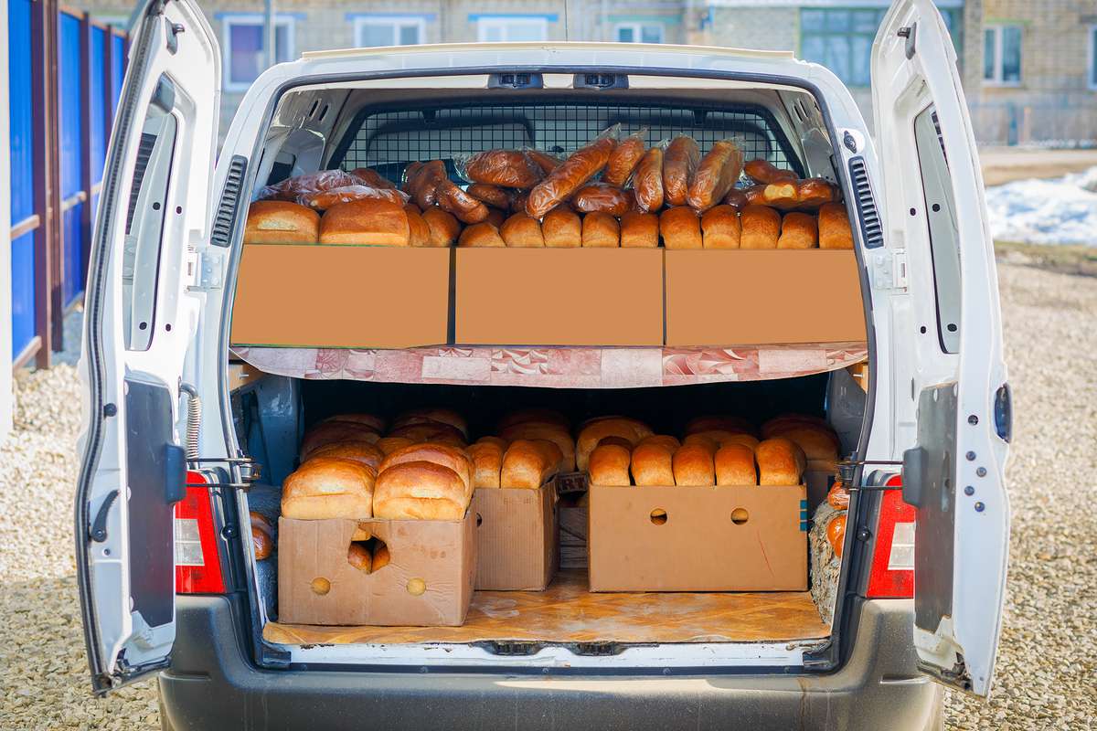 A car van is loaded with fresh hot bread
