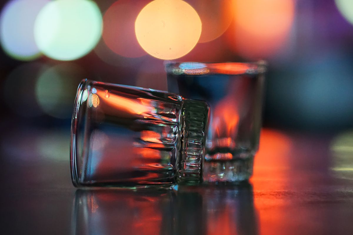 Empty shot glasses on a bar
