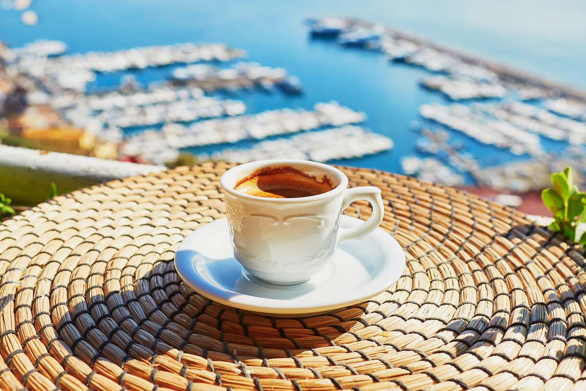A cup of fresh espresso coffee in a cafe with view in Naples, Campania, Italy