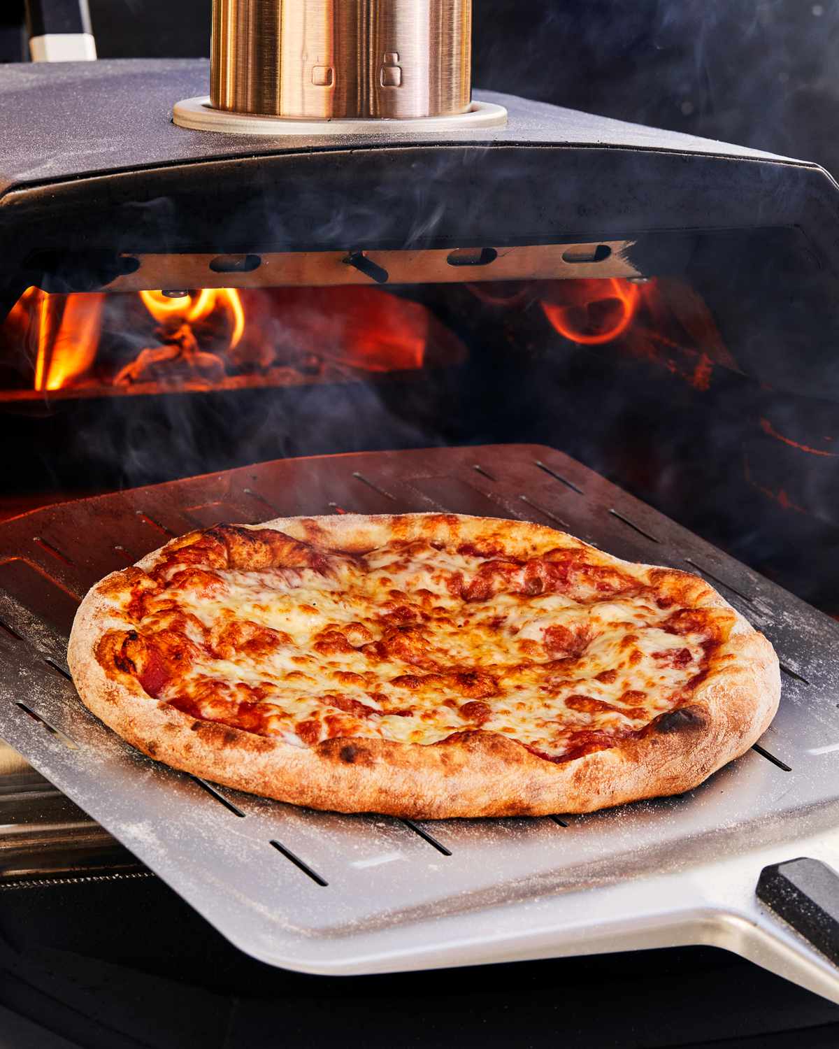 Classic cheese pizza in pizza stove