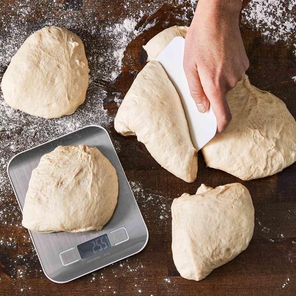 cutting pizza dough into portions