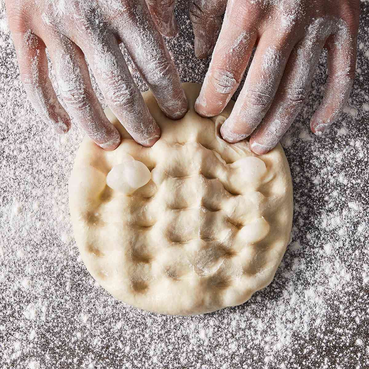 fingers docking pizza dough