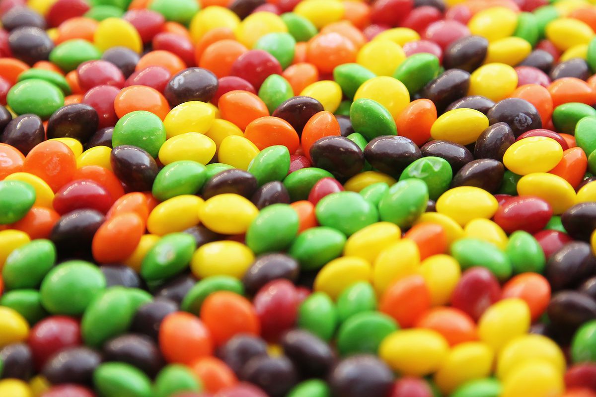 A closeup of a bowl of Skittles