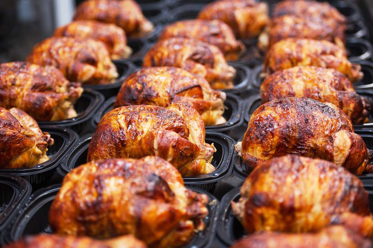 Cooked rotisserie chickens are displayed for sale at a Costco Wholesale store