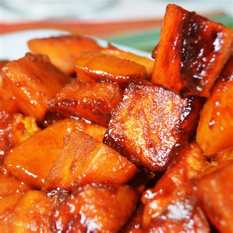 In a medium pot, bring water and sugar to a rolling boil, add butter, lemon juice, nutmeg, cinnamon and sliced yams or sweet potatoes soul food yams recipe