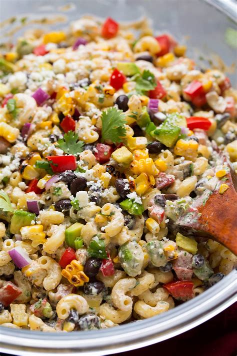 Place the macaroni, corn, beans, olives, tomatoes, green onions, red onion, and cilantro (if using) in a large bowl corn pasta salad pioneer woman
