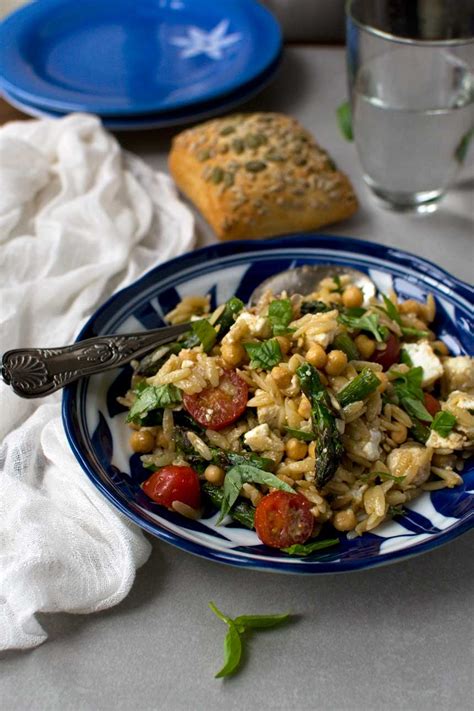 24 ounces cherry tomatoes, halved, ½ cup olive oil, divided, 1 ½ teaspoons kosher salt, divided, plus more for water, 1 pound uncooked orzo, 2 tablespoons red cherry tomato orzo salad recipe