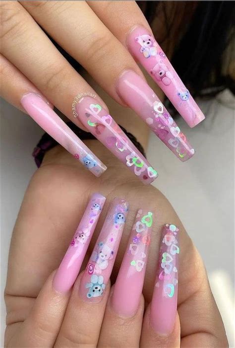While all the fingertips flaunt a subtle shade of pink covered in half by charming silver glitter, one of the tips  romantic pink nail designs that will rock your valentine's day
