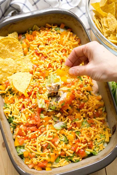 Top each with a cube of manchego cheese and 7 layer dip pioneer woman