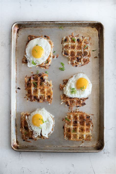 How to make hash browns in a waffle maker, start by whisking up a few eggs and some milk, then stir them into the potatoes with some shredded cheesy hash brown waffles