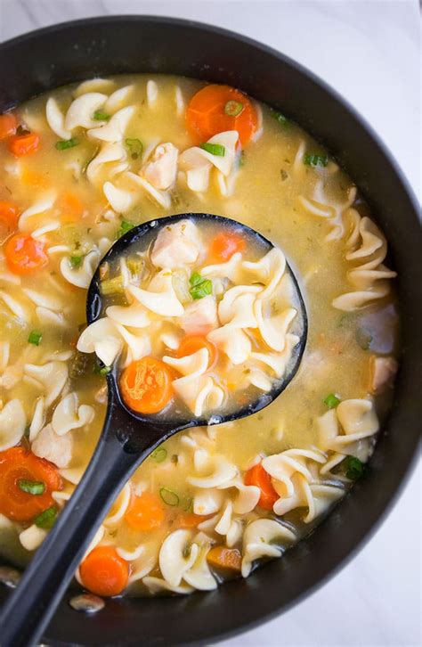 homemade chicken noodle soup with whole chicken in crock pot