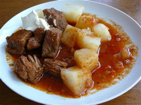 It is a hearty beef stew seasoned with savory vegetables and warm spices beef goulash with dumplings recipe