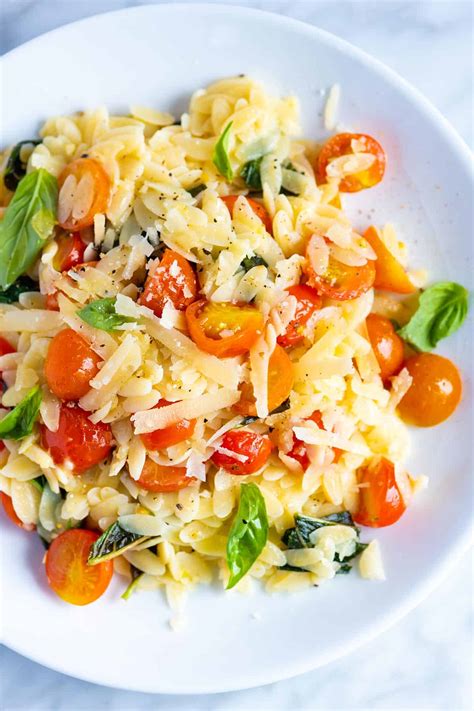 In a large bowl whisk together garlic, parsley, vinegar, remaining tablespoon oil, cherry tomato orzo salad recipe