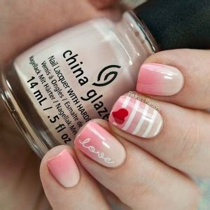 Valentine’s day is celebrated in honor of st pretty-in-pink valentine's day nails you'll love