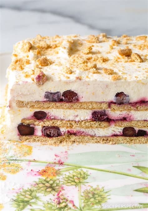 This summer berry icebox cake is a healthier summer treat featuring summer berries, strawberry spread, yogurt, cream and graham crackers no bake summer berry icebox cakes