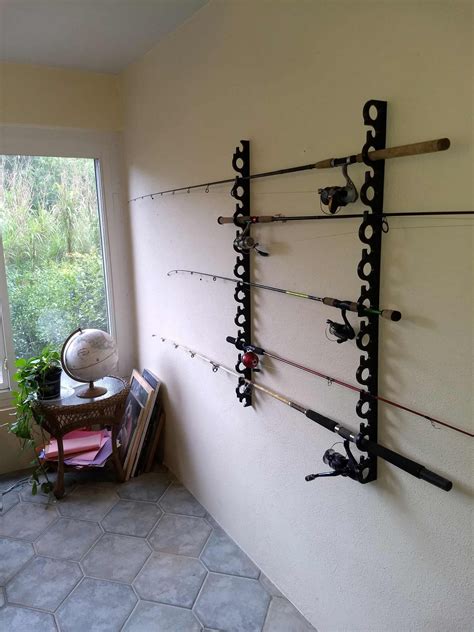 Beginners can build an easy rack designed to store rods, reels, nets and lures fishing pole holder woodworking plans