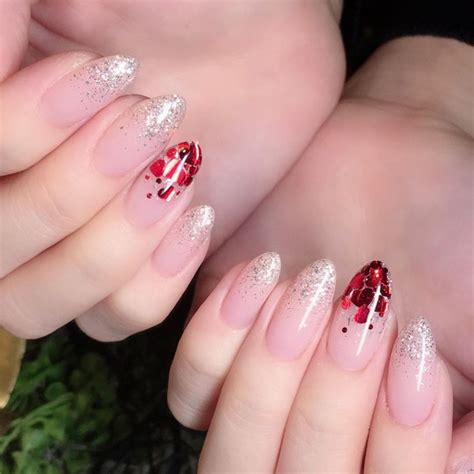 For these nails, you will need to create a french tip using a light pink nail color and add some tiny red hearts and polka dots to the tips to  valentine's day nails in pink - an easy guide